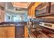Well-equipped kitchen with modern appliances and a stylish backsplash at 7564 Bayshore Dr # 202, Treasure Island, FL 33706