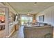 Comfortable living room with beach views and stylish wood paneling at 7564 Bayshore Dr # 202, Treasure Island, FL 33706