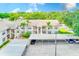 Aerial view of the condo complex with covered parking and lush landscaping at 7823 Hardwick Dr # 224, New Port Richey, FL 34653