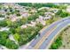 Aerial view features community with trees and shrubs, with a glimpse of the highway in the foreground at 7823 Hardwick Dr # 224, New Port Richey, FL 34653
