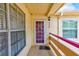 Close-up of a condo entrance featuring a secure door and a cozy, private landing area at 7823 Hardwick Dr # 224, New Port Richey, FL 34653