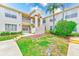 Inviting exterior of a condo complex with well-maintained landscaping and a charming, covered entrance at 7823 Hardwick Dr # 224, New Port Richey, FL 34653