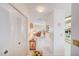 Hallway with closet leading to living room and kitchen areas of the home at 7823 Hardwick Dr # 224, New Port Richey, FL 34653