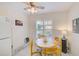 Eat-in kitchen featuring a round table, shuttered windows, and tile floors at 7823 Hardwick Dr # 224, New Port Richey, FL 34653