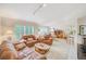 Bright living room connected to the dining and kitchen area, ideal for entertaining and daily living at 7823 Hardwick Dr # 224, New Port Richey, FL 34653