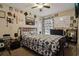 Cozy bedroom features patterned bedding, and custom décor on the walls at 814 Cape Cod Cir, Valrico, FL 33594