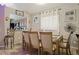 The formal dining area with a view to the kitchen has a traditional wooden dining set at 814 Cape Cod Cir, Valrico, FL 33594