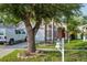 A charming home with a well-manicured lawn, mature tree, and a white mailbox, exuding curb appeal at 814 Cape Cod Cir, Valrico, FL 33594