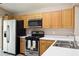 A kitchen features stainless steel appliances, countertops, and light wood cabinets at 814 Cape Cod Cir, Valrico, FL 33594