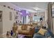 Cozy living room with a plush sofa, adorned with elegant décor and a view into the dining area at 814 Cape Cod Cir, Valrico, FL 33594
