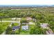 Overhead shot of a quiet neighborhood with single-Gathering homes amidst lush greenery at 8329 Gulf Way, Hudson, FL 34667