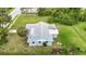 Birds eye view of a home with lush greenery, showcasing backyard and tree coverage at 8329 Gulf Way, Hudson, FL 34667