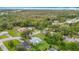 Picturesque aerial view of a peaceful neighborhood with houses and verdant landscaping at 8329 Gulf Way, Hudson, FL 34667