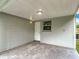 Covered back patio, perfect for outdoor lounging at 8329 Gulf Way, Hudson, FL 34667