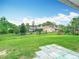 Spacious backyard with lush green grass and a view of the neighboring property and trees at 8329 Gulf Way, Hudson, FL 34667