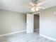 Bedroom featuring neutral walls, marble floors, and a bright window at 8329 Gulf Way, Hudson, FL 34667