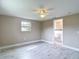 Cozy bedroom with natural light and a ceiling fan at 8329 Gulf Way, Hudson, FL 34667