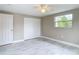 Bright bedroom with double closet and marble-look floors at 8329 Gulf Way, Hudson, FL 34667