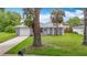 A charming single-story home with fresh exterior paint, an attached garage, and a well-maintained lawn at 8329 Gulf Way, Hudson, FL 34667