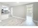 Open-concept living area showcasing kitchen, new floors and neutral colors at 8329 Gulf Way, Hudson, FL 34667