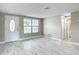 Bright living room with new flooring, neutral paint, and ample natural light at 8329 Gulf Way, Hudson, FL 34667