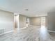 Bright, airy living room featuring marble-look floors, neutral paint, and open-concept design at 8329 Gulf Way, Hudson, FL 34667