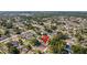 Scenic aerial view highlighting the home's setting in a well-treed community with nearby amenities at 9053 Hickory Cir, Tampa, FL 33615