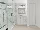 Updated bathroom with a glass shower, marble tile, and modern fixtures at 9053 Hickory Cir, Tampa, FL 33615