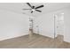 Spacious bedroom features wood-look floors, ceiling fan, and closet at 9053 Hickory Cir, Tampa, FL 33615