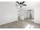 Bedroom featuring a ceiling fan, natural light, and a mirrored closet at 9053 Hickory Cir, Tampa, FL 33615