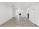 Spacious living room featuring wood floors, white walls and natural light at 9053 Hickory Cir, Tampa, FL 33615