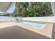 Backyard pool and deck area surrounded by privacy fence at 9053 Hickory Cir, Tampa, FL 33615