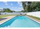 Backyard pool and deck area surrounded by privacy fence at 9053 Hickory Cir, Tampa, FL 33615