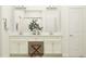 Main bathroom featuring double vanity, a walk-in shower and vanity seating at 9779 Minnow Ray Dr, Land O Lakes, FL 34638