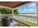 Exterior balcony overlooking a scenic river view and boat dock; furnished with outdoor seating at 101 Pompano Se Dr # C, St Petersburg, FL 33705