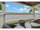 Balcony with wicker furniture and view of the water at 101 Pompano Se Dr # C, St Petersburg, FL 33705