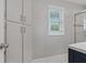 Bathroom with built in cabinets and a window with natural light at 101 Pompano Se Dr # C, St Petersburg, FL 33705