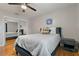 Bedroom with a bed, side table, and mirrored closet doors at 101 Pompano Se Dr # C, St Petersburg, FL 33705