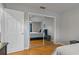Bedroom with mirrored closet doors and wood flooring at 101 Pompano Se Dr # C, St Petersburg, FL 33705