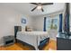 Comfortable bedroom with a bed, side table, window and TV at 101 Pompano Se Dr # C, St Petersburg, FL 33705