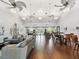 Spacious clubhouse with sofas, tables, chairs, and a decorative arrangement with high ceilings and wood flooring at 101 Pompano Se Dr # C, St Petersburg, FL 33705