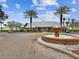 The community clubhouse features a fountain, green lawn, palm trees, and a brick drive at 101 Pompano Se Dr # C, St Petersburg, FL 33705