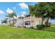 Townhome exterior featuring private balconies with river views and lush landscaping at 101 Pompano Se Dr # C, St Petersburg, FL 33705