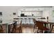 Clubhouse kitchen and lounge area with barstool seating and modern pendant lighting at 101 Pompano Se Dr # C, St Petersburg, FL 33705