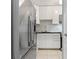 Modern kitchen with stainless steel appliances, white cabinets, and a bright, clean aesthetic in this home at 101 Pompano Se Dr # C, St Petersburg, FL 33705