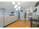 Open-concept living area features a comfortable sofa, television, and a view into the adjacent modern kitchen at 101 Pompano Se Dr # C, St Petersburg, FL 33705