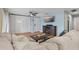 Relaxing living room showcasing modern furniture, including a large sofa and entertainment center with a fireplace at 101 Pompano Se Dr # C, St Petersburg, FL 33705