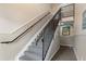 Interior stairwell with carpeted steps and iron railing in a building at 101 Pompano Se Dr # C, St Petersburg, FL 33705