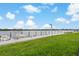Exterior view of waterfront community dock with boat mooring and green lawn at 101 Pompano Se Dr # C, St Petersburg, FL 33705