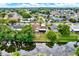 Scenic aerial view showcasing waterfront property with lush trees reflecting in water at 10407 Oleander Dr, Port Richey, FL 34668